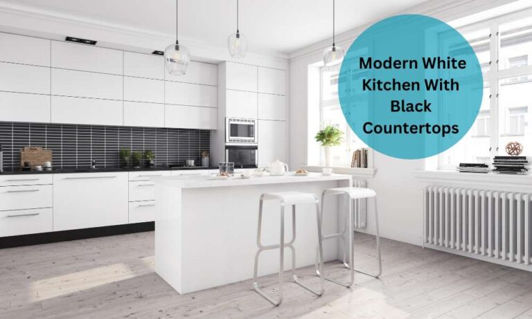 Modern White Kitchen With Black Countertops