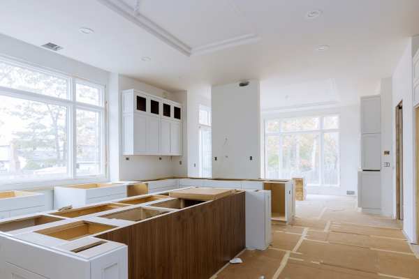 Monochromatic Artwork Modern White Kitchen With Black Countertops