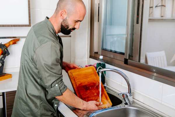 Rinse The Cutting Board With Hot Water