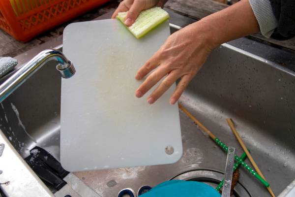 Use A Soft Cloth To Scrub The Surface Of The Cutting Board