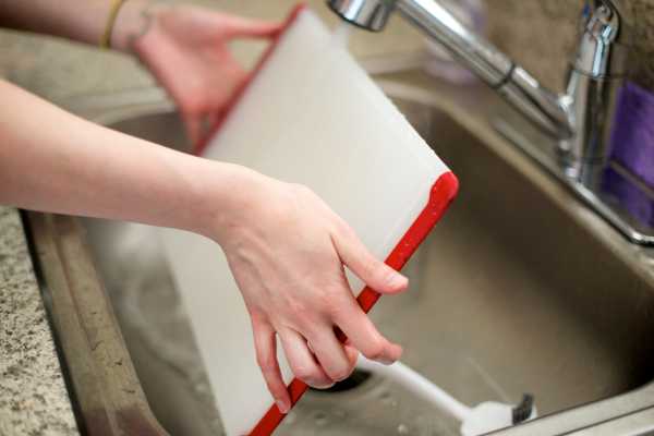 Wet The Sponge And Scrub The Cutting Board Once Again